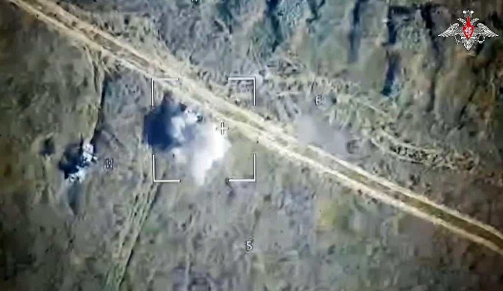 An image from footage released by the Russian Defence Ministry on 6 August 2024, showing a Russian drone attack on Ukrainian armoured vehicles outside the town of Sudzha in the Kursk Region. (Russian Defence Ministry / AFP) 