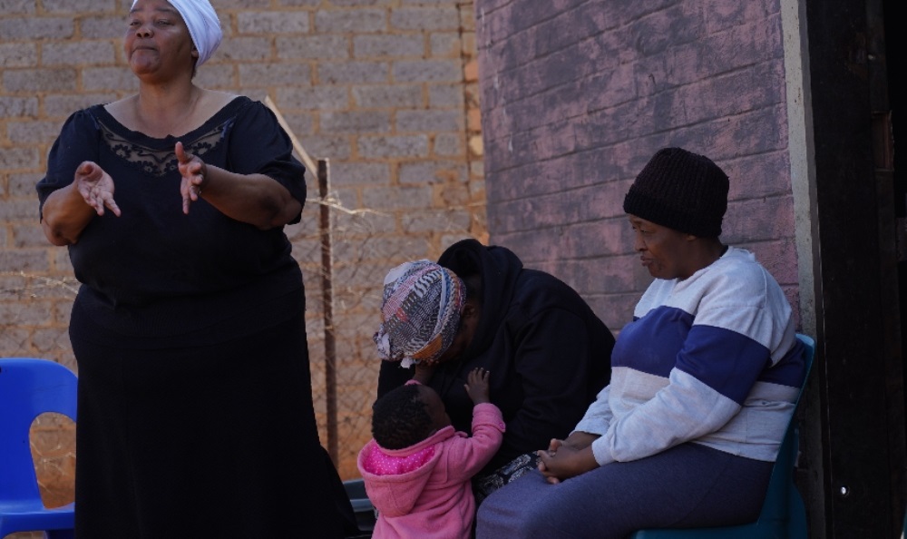 Dibuseng Mokhatla (middle) grieving the loss of her three children in Evaton. (Alfonso Nqunjana/News24)