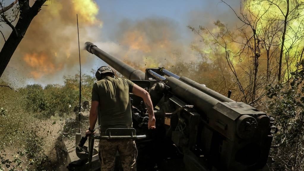 A Ukrainian serviceman of the 24th Mechanised Brigade fires a 2s5 'Hyacinth-s' 152mm self-propelled howitzer toward Russian positions at an undisclosed location in Donetsk region, amid the Russian invasion of Ukraine. (Handout/24th Mechanised Brigade of Ukrainian Armed Forces/AFP)