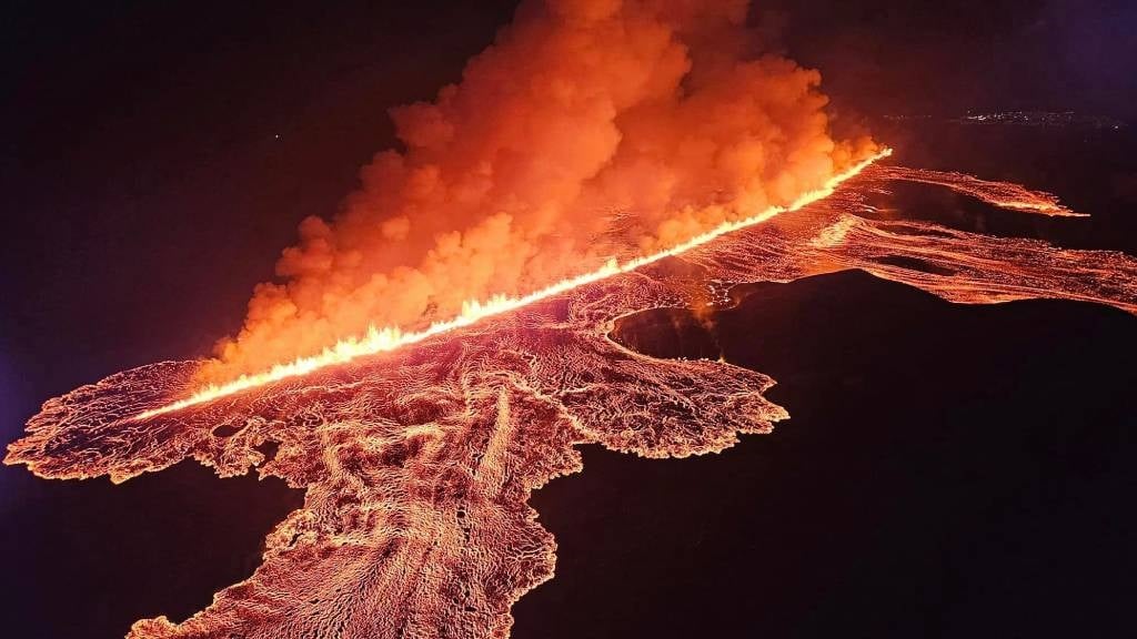 This handout picture by the Public Defence Department of the State Police in Iceland shows lava and smoke erupting from a volcano near Grindavik on the Icelandic peninsula of Reykjanes. (Public Defence Department of the State Police/AFP)