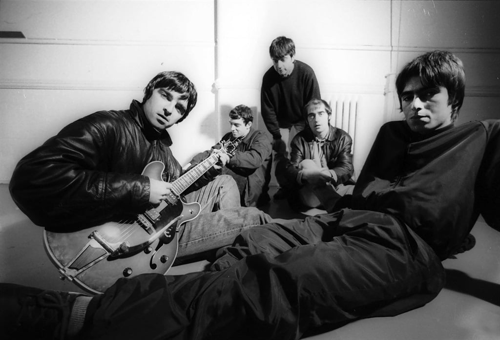 Group portrait of British rock band Oasis at Nomad