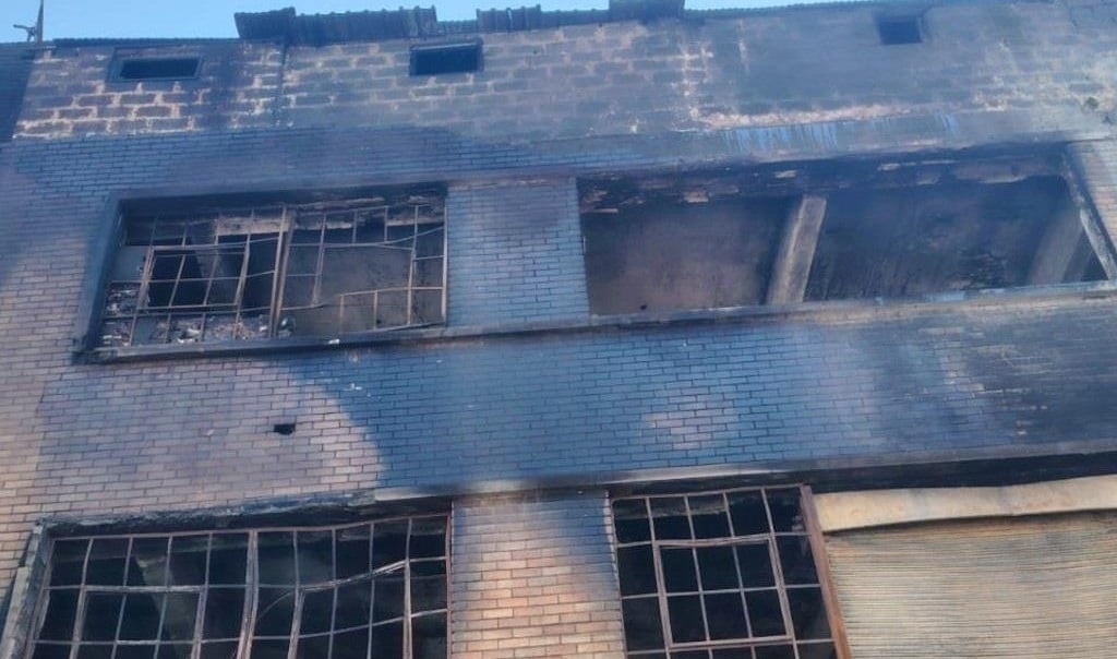 The hijacked Enkanini building where four people were killed by a fire on Sunday. (Ntwaagae Seleka/News24)