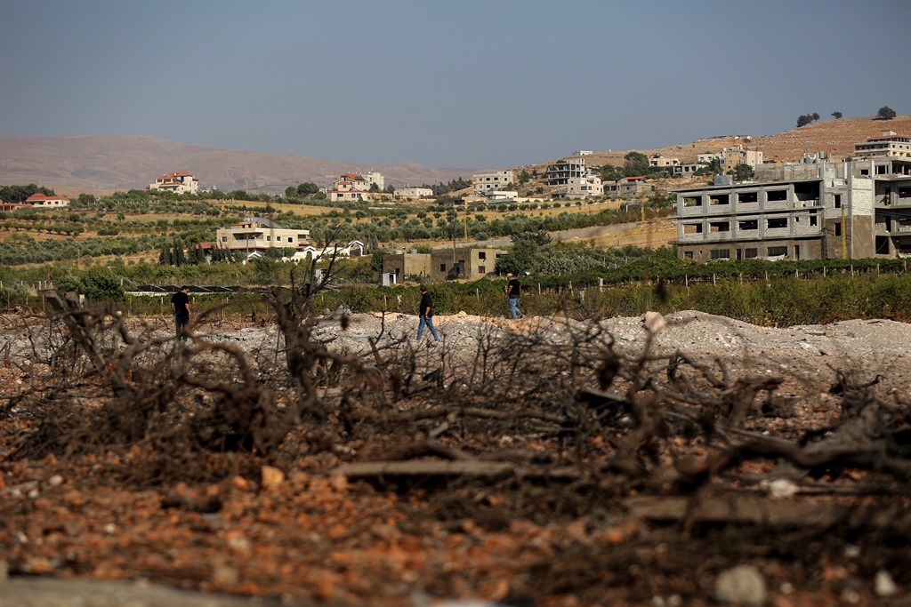 Hezbollah members inspect the site where Israeli warplanes raided what believed to be an ammunition depot in the village of Nabi Sheet in Lebanese eastern Bekaa valley last week. (Marwan Naamani/picture alliance via Getty Images)