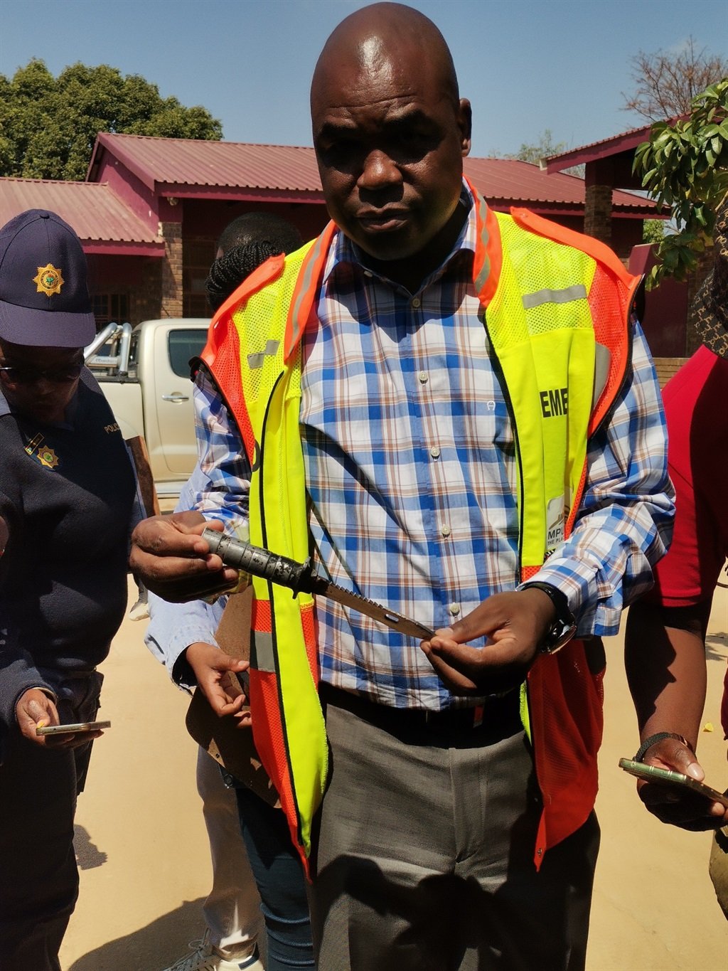 MEC Jackie Macie holding a knife that was found in