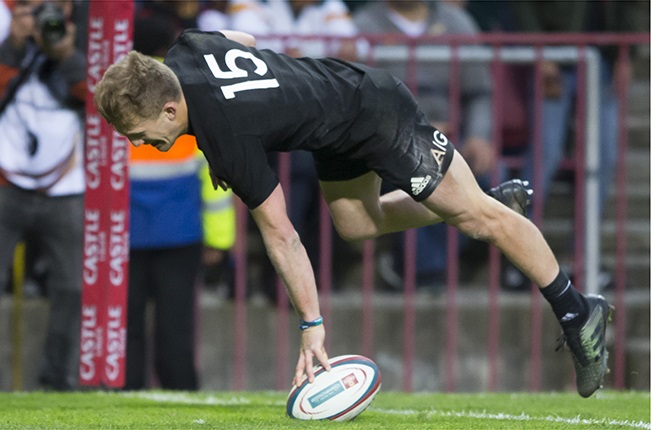 Damian McKenzie, seen here scoring in the 2017 All Black/Springbok Test, is much loved by All Black fans who last saw him play in Cape Town in 2017 and will be widely supported on Saturday. along with his teammates. (Dirk Kotze/Gallo Images/Getty Images)