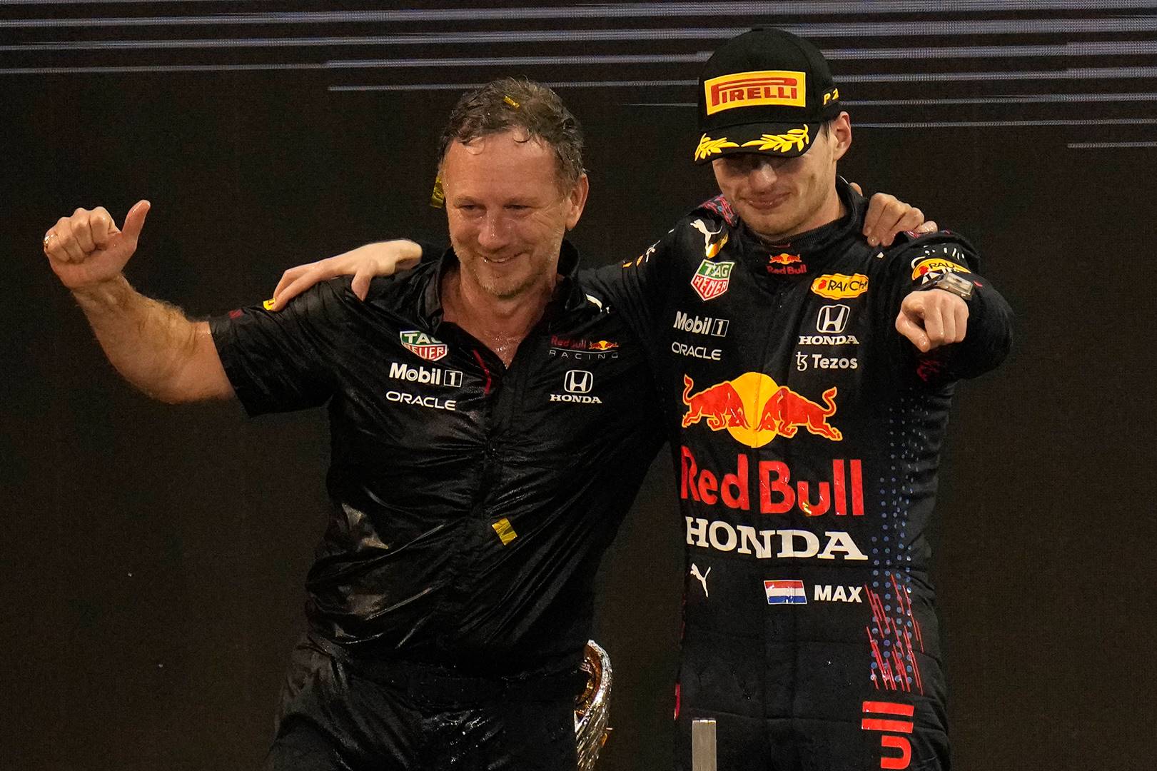 Christian Horner (left) and Max Verstappen celebrate after the 2021 Abu Dhabi Grand Prix