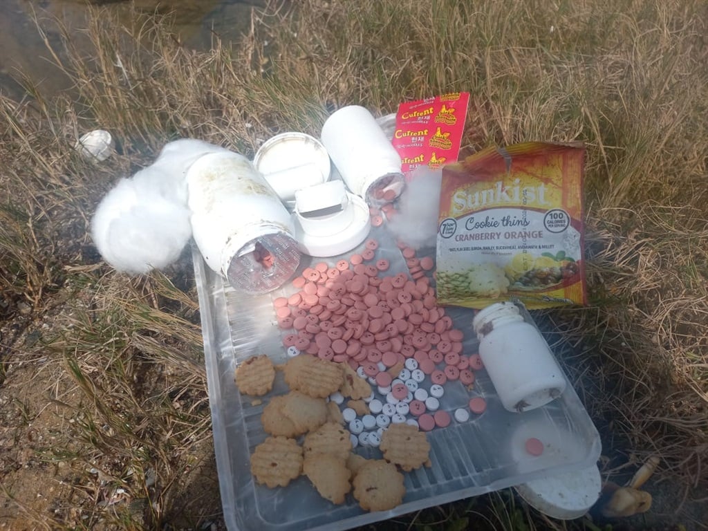 Various pills and food items washed ashore at Nelson Mandela Bay beaches. (Candice Bezuidenhout/News24)