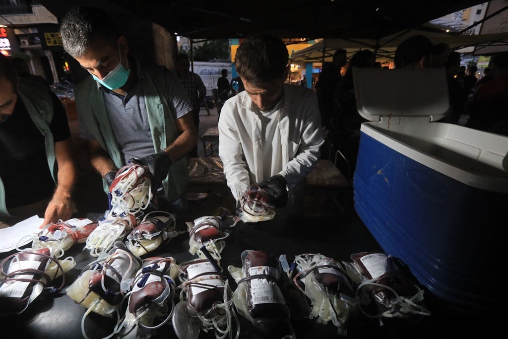 Medics collect blood donations in Beirut's southern suburb on 17 September  2024, after hundreds of pagers used by Hezbollah members exploded across Lebanon. (AFP)