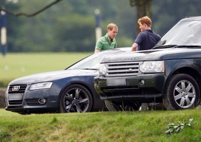 NICE S5: Prince William and his brother Harry discussing helicopters (probably) next to a Polo field. The Range Rover in frame is not a royal car, the Audi is…