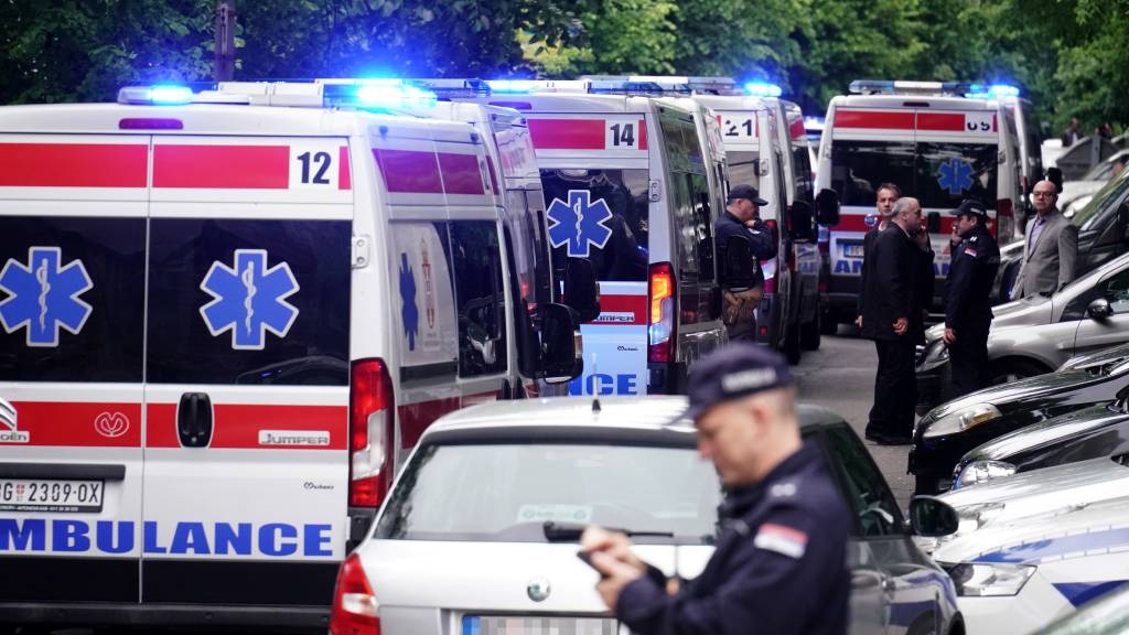 Ambulances and police officers arrive following a 