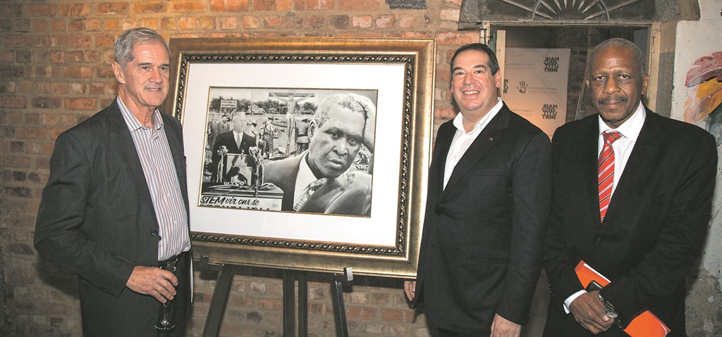 Roelf Meyer (left), Ivor Ichikowitz and Mathews Phosa with the Chief Laureate of Peace drawing of Chief Albert Luthuli  