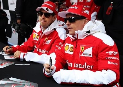 <b>READY TO RACE:</b> Ferrari's Sebastian Vettel (left) and Kimi Raikkonen meet fans ahead of the 2016 Canadian GP in Montreal. <i>Image: Tom Boland/The Canadian Press via AP</i>