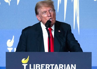 'We should not be fighting each other': Trump appeals to libertarians who boo and jeer at him