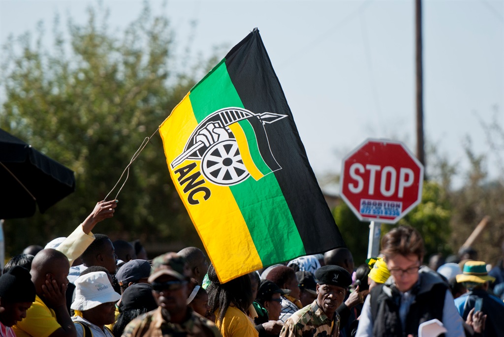 ANC supporters wave a party flag. 