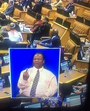 An interpreter for the deaf translates a comment made in the National Assembly during the State of the Nationa Address.