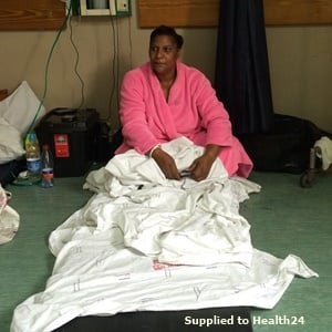 A woman on the floor at Edenvale Hospital in Gauteng. (Supplied)