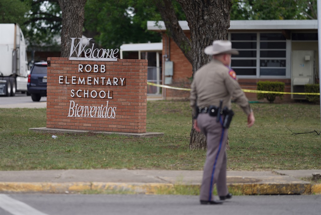 An officer walks outside of Robb Elementary School in Uvalde, Texas, on 24 May, 2022. 
