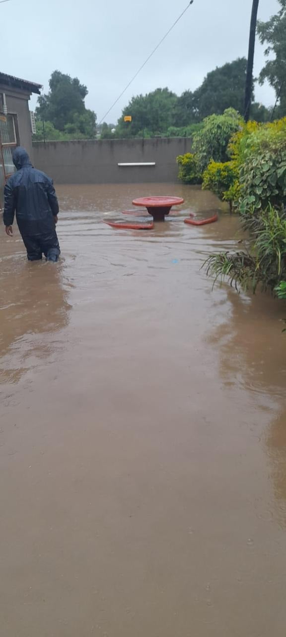 Man wading through flooded streets