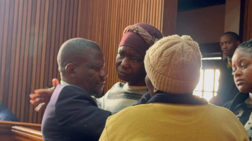 WATCH: Red-eyed 'killer' dad in the dock!