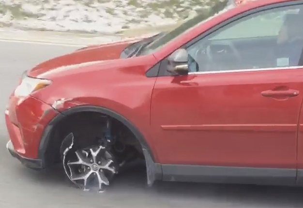 <B>WOULD YOU LOOK AT THAT!</B> This Toyota Rav4 continued driving with an exposed rim on along a US freeway. <I>Image: Facebook</I>