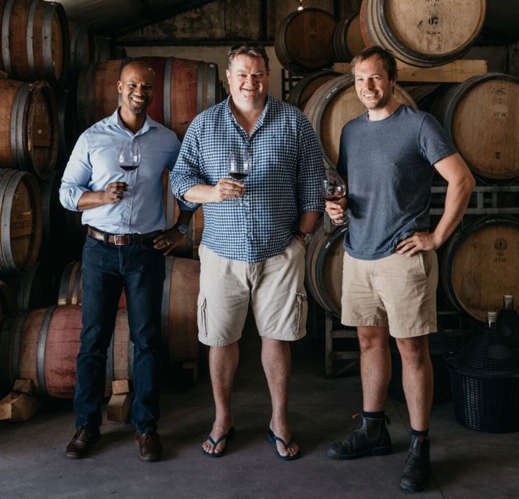 Mzokhona Mvemve, Bruwer Raats, and Gavin Bruwer in the cellar at Raats Family Wines.
