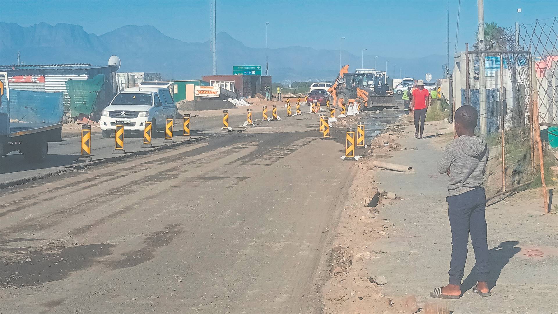 Road workers are busy working at Japhta K. Masemola Road in Makhaza.PHOTO: UNATHI OBOSE