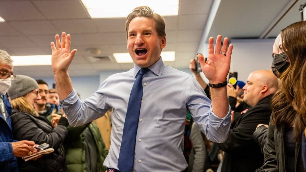 Democratic challenger Dean Phillips is greeted by supporters during a campaign rally in Nashua, New Hampshire. 