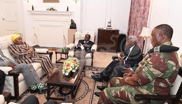 President Robert Mugabe (centre) in a meeting with the ZDF Commander General Constantino Chiwenga, South African Minister of Defence Minister Nosiviwe Mapisa-Nqakula (in yellow head gear), Zimbabwe Defence Minister Dr Sydney Sekeramayi and Zimbabwe State Security Minister Cde Kembo Mohadi at State House in Harare.