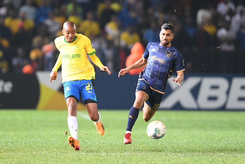 PRETORIA, SOUTH AFRICA - APRIL 26:  Thapelo Morena2 of Mamelodi Sundowns  and  Houssam Ghacha of  ES Tunis during the CAF Champions League semi-final 2nd Leg match between Mamelodi Sundowns and ES Tunis at Loftus Versfeld Stadium on April 26, 2024 in Pretoria, South Africa. (Photo by Lefty Shivambu/Gallo Images)