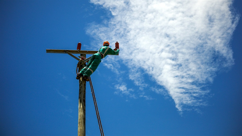A worker prepares for the installation of electric