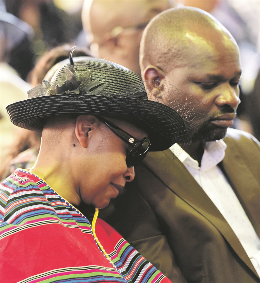 Florence Masebe is comforted at her son’s memorial service yesterday.       Photos by Lucky Morajane  