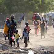 Government forces and civilians flee to Chad as Sudan burns
