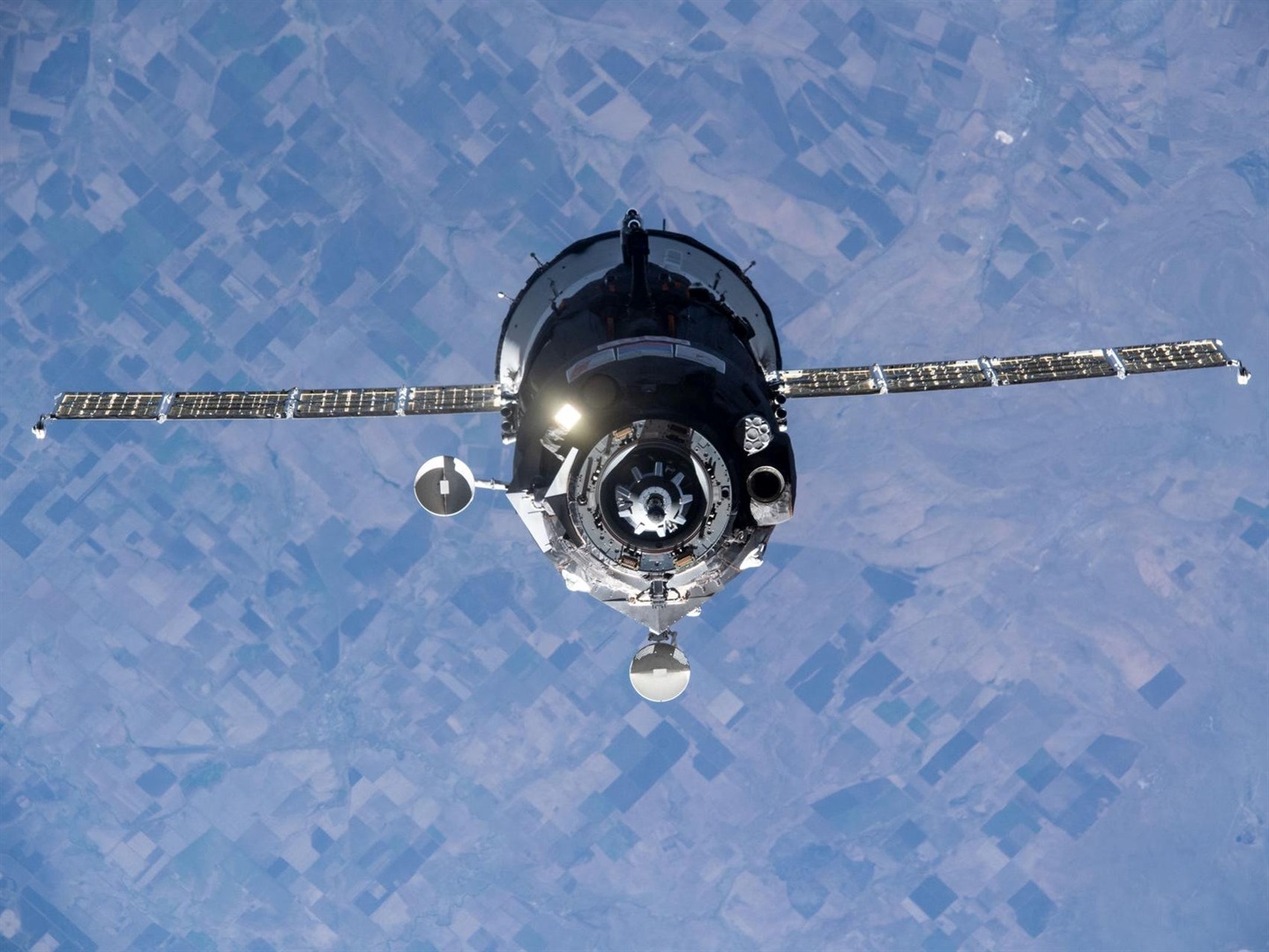 A Soyuz spaceship carrying a Russian film crew and a cosmonaut approaches the International Space Station, on October 5, 2021.