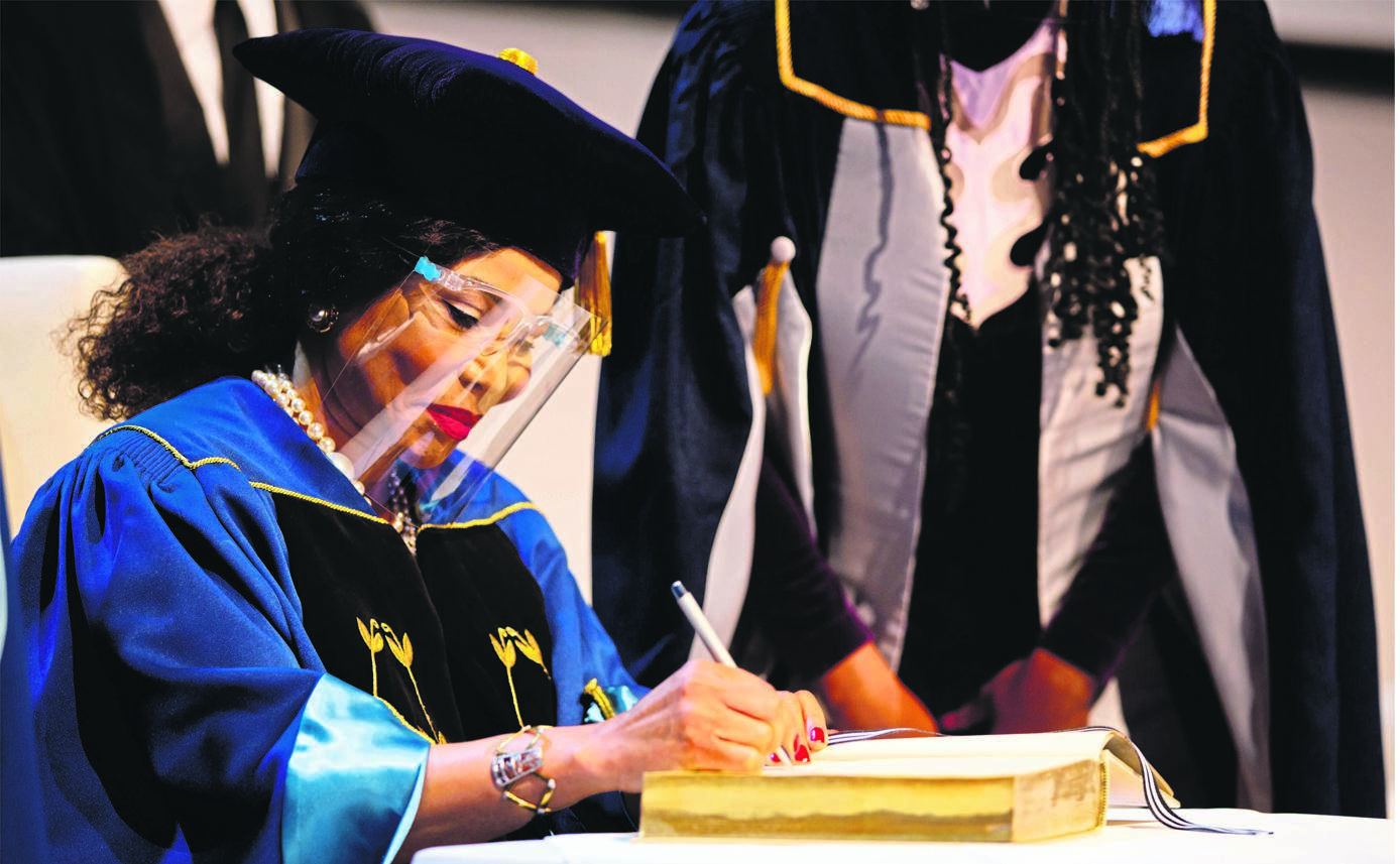 The University Golden Book, which Dr Precious Moloi-Motsepe is signing, is reserved for distinguished guests and the recipients of honorary doctorates.