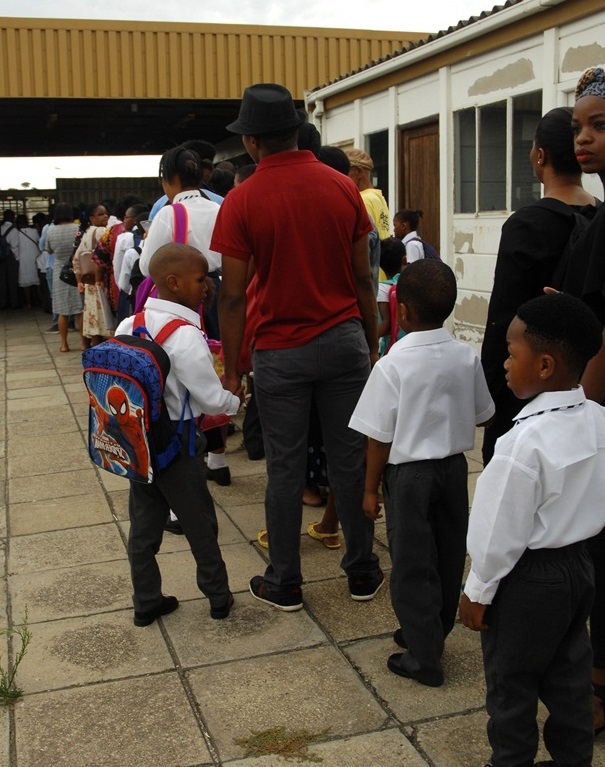 Parents lined up to register their kids at EduPlanet, an unregistered school operating from an industrial area in Port Elizabeth.  Photo by Chris Qwazi 
