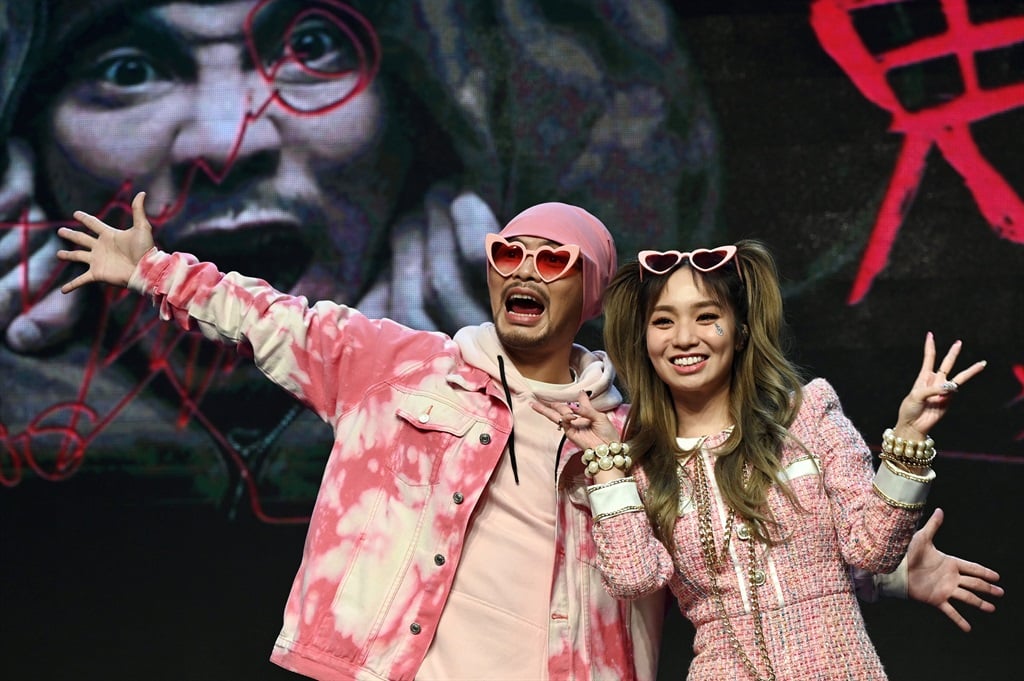 Malaysian rapper Wee Meng Chee (L), known by his stage name Namewee, and Taiwan-based Australian singer Kimberley Chen, take part in a press conference together in Taipei on November 15, 2021. (Sam Yeh / AFP)