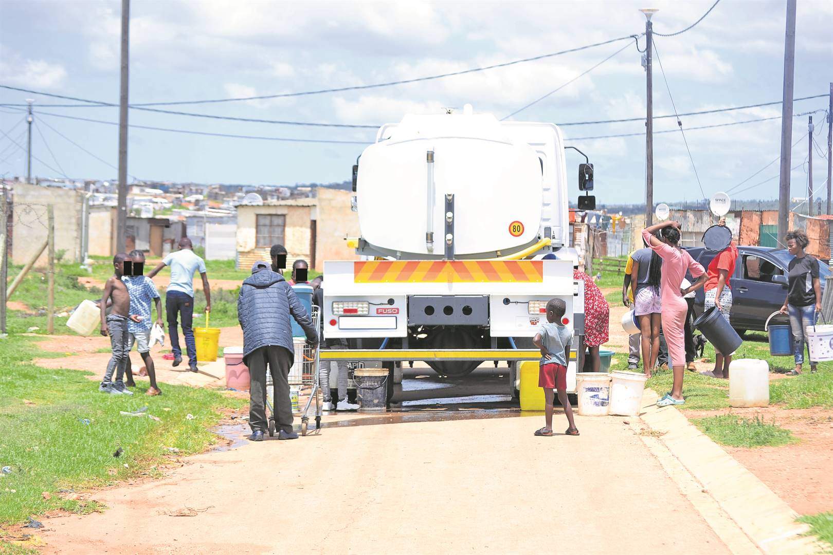 Residents of Area 11 in Gunguluza collect water from a water truck daily as their taps have been dry for months.           Photo by Luvuyo Mehlwana