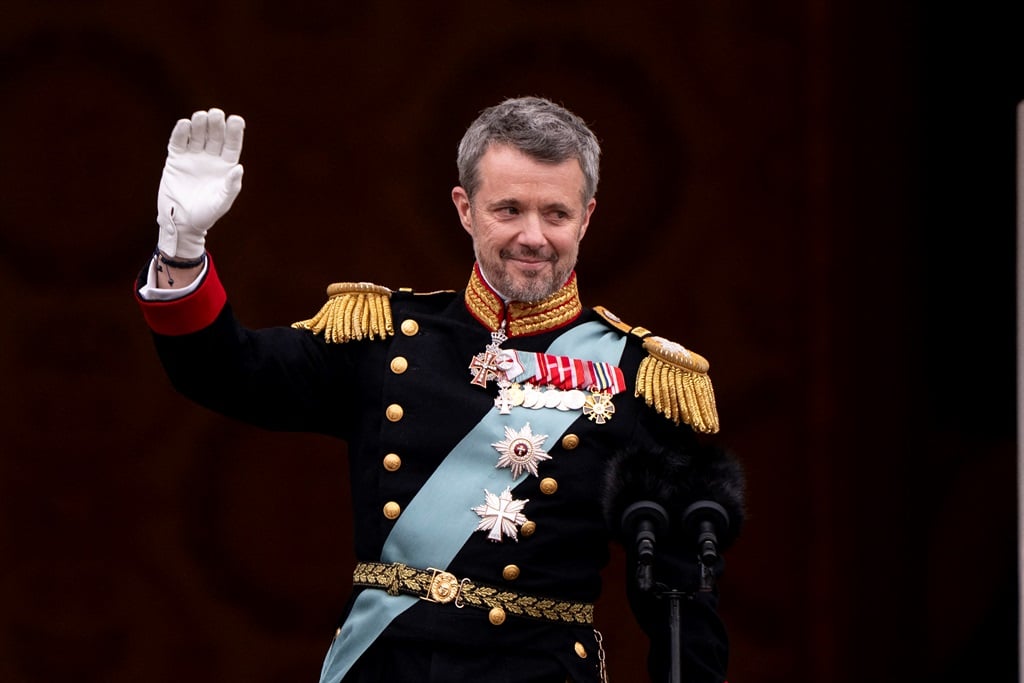 Danish King Frederik X waves to the crowd after a 