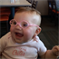 Baby girl gets glasses and can finally see her parents clearly