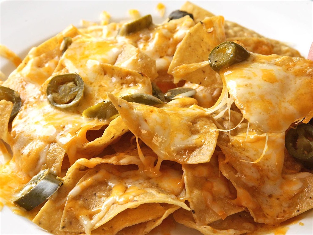  Cheesy nachos are perfect to serve as an appetizer for your New Year’s Eve get-together.  