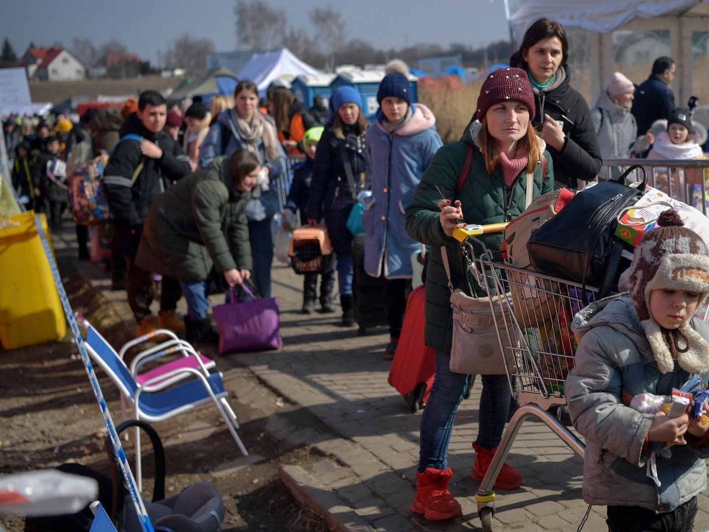 Ukrainian refugees are seen after crossing into Poland on March 13, 2022. LOUISA GOULIAMAKI/AFP via Getty Images