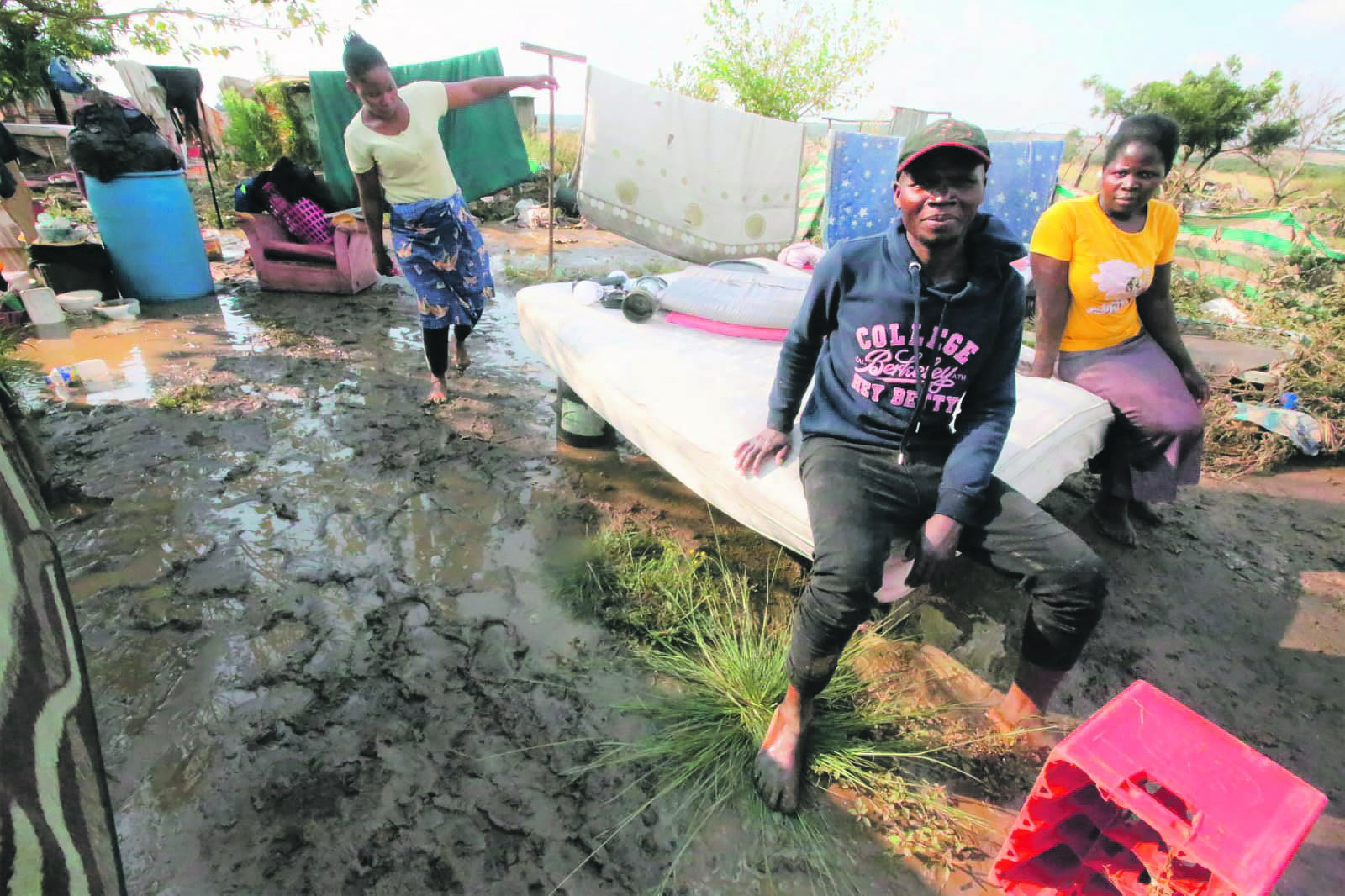 Gaston Chimwewe and Stella Chingoma are some of the residents who found themselves on rooftops after water entered their homes.        Photo by Raymond Morare