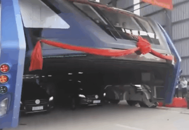 <B>FLOATING BUS:</B> China is testing its new floating bus capable of riding above traffic. <I>Image: AP / Luo Xiaoguang</I>
