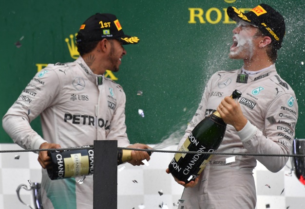 <B>HE DID IT!</B> Mercedes' Nico Rosberg wins his first title at the Abu Dhabi GP. <I>Image: AFP / Nelson Almeida</I>