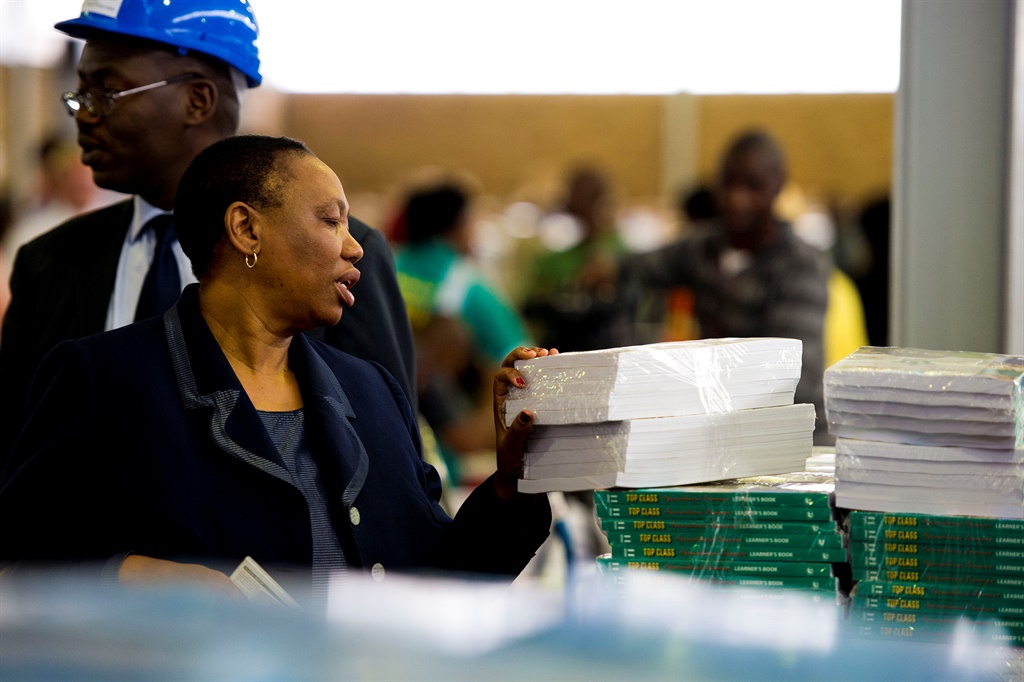 Basic Education minister Angie Motshekga visits a warehouse full of textbooks ready for delivery in 2012 in Limpopo. The province continues to struggle to get books to schools. Photo by Gallo Images 