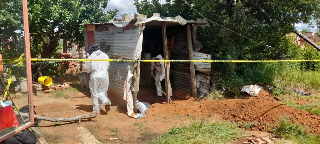 Four people were arrested following discovery of a decomposing body of a woman, 60.