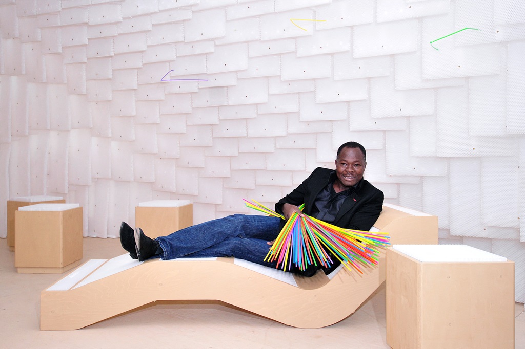 In this file photo taken on January 21, 2014 Burkina Faso-born German architect Diebedo Francis Kere poses next to his installation at the Royal Academy of Arts in central London during a photocall for the forthcoming 'Sensing Spaces: Architecture Reimagined' exhibition which is due to run from January 25, to April 6, 2014. The Pritzker Prize -- architecture's most prestigious award -- was awarded March 15, 2022 to Burkina Faso architect Diebedo Francis Kere, organisers announced.