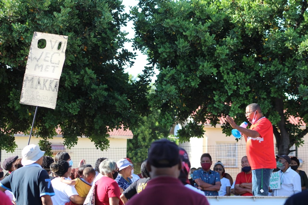 Residents picketed outside the Piketberg Magistrate's Court on Tuesday when a police officer charged with murdering a woman appeared in court.