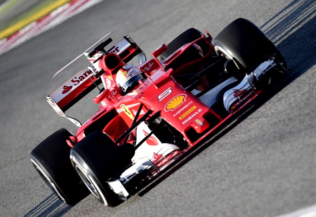 <B>FERRARI RESURGENCE:</B> Sebastian Vettel recorded a solid day for Ferrari as pre-season testing begins. <I>Image: AFP / Jose Jordan</I>