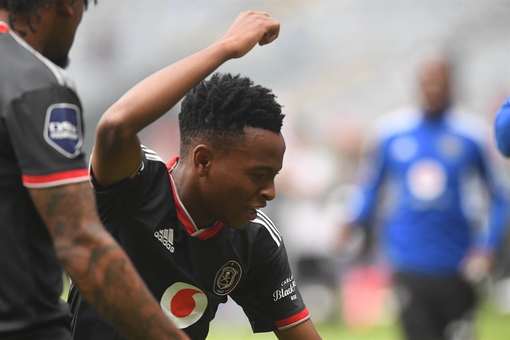 JOHANNESBURG, SOUTH AFRICA - MAY 03:  Relebohile Ratomo of Orlando Pirates takes a strike and scores the only goal and celebrate with teammates during the DStv Premiership match between Orlando Pirates and Royal AM at Orlando Stadium on May 03, 2023 in Johannesburg, South Africa. (Photo by Sydney Seshibedi/Gallo Images)